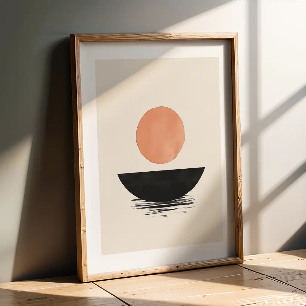 Framed Japandi print leaning against a light gray wall on a wooden floor, with natural light and shadow play.